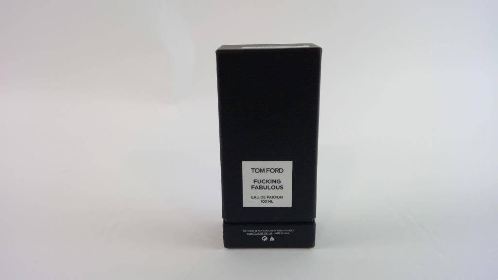 A black rectangular Tom Ford fragrance box with a white label reading 'TOM FORD FUCKING FABULOUS Eau de Parfum' on a plain light background.