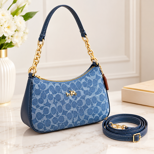 Coach blue signature canvas shoulder bag with elegant gold-tone chain strap and designer-inspired styling