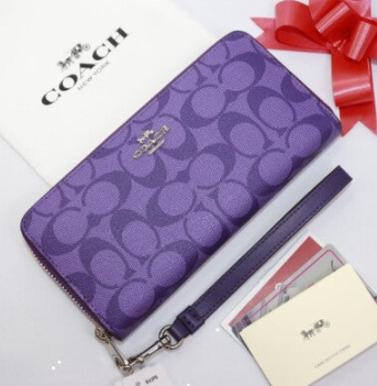 Coach purple signature canvas long zip-around wallet with leather trim and detachable wrist strap